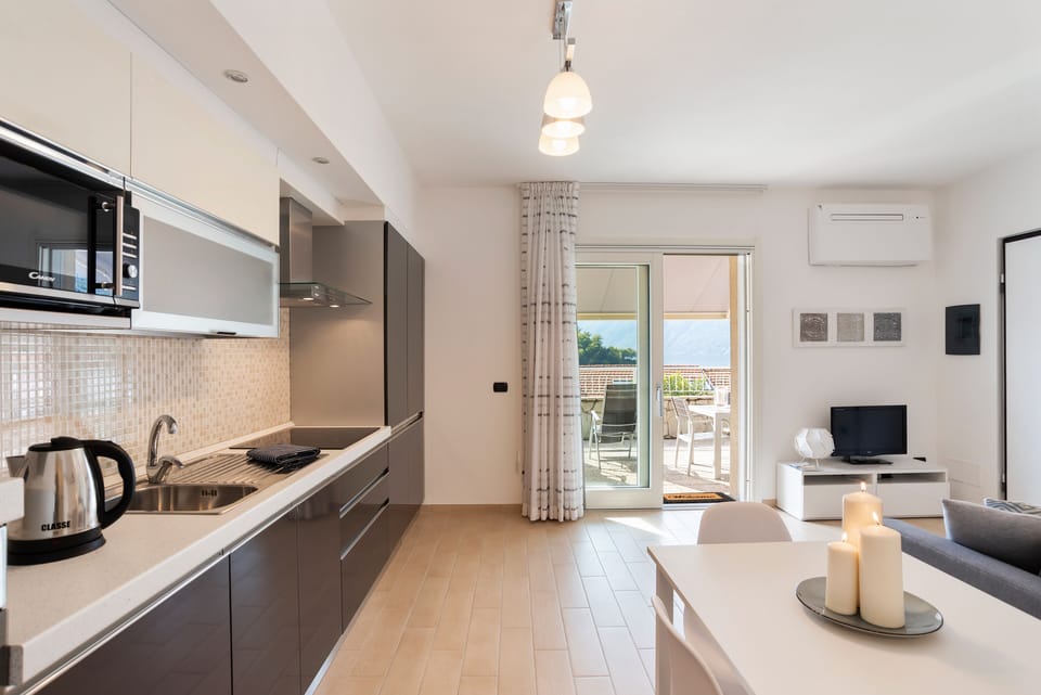 Panoramic Apartment | Living area | 30-inch TV with digital channels