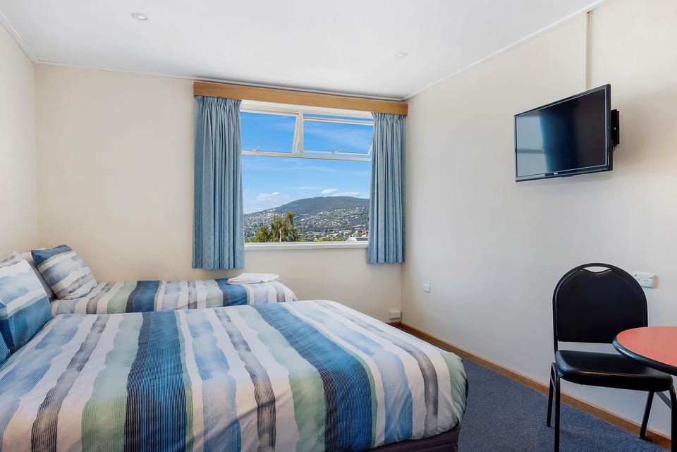 Twin Room | Laptop workspace, iron/ironing board, free WiFi, bed sheets