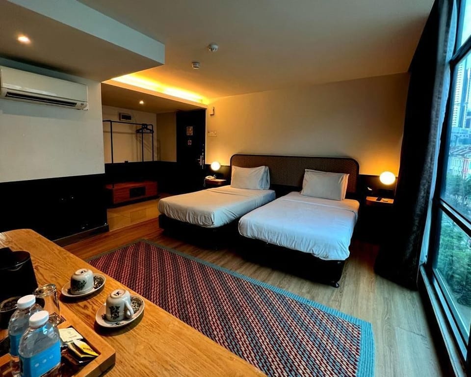 Superior Twin Room | Minibar, in-room safe, desk, laptop workspace