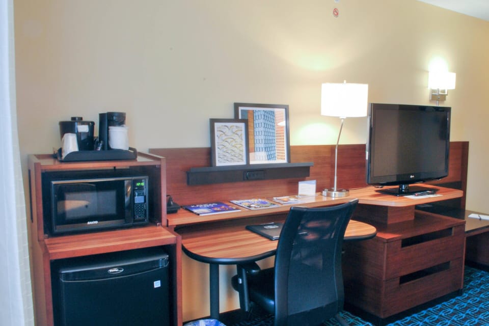 Premium bedding, desk, laptop workspace, iron/ironing board