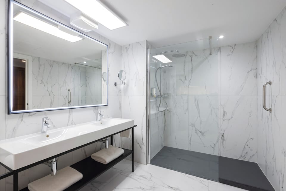 Shower, eco-friendly toiletries, hair dryer, towels