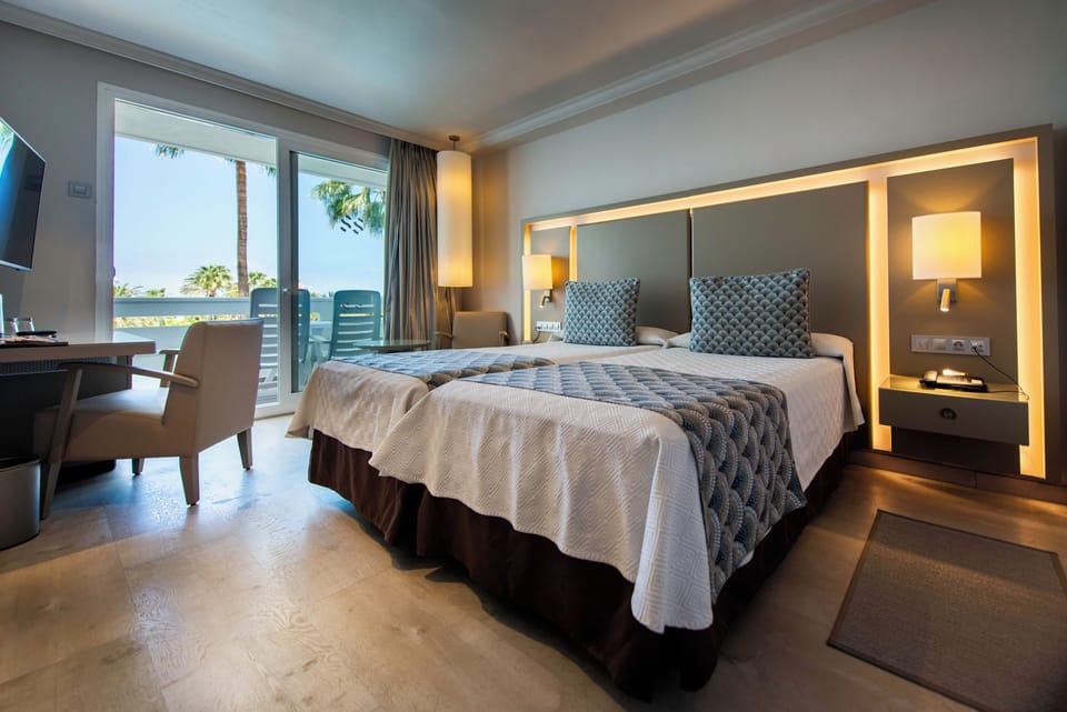 Minibar, blackout drapes, iron/ironing board, bed sheets