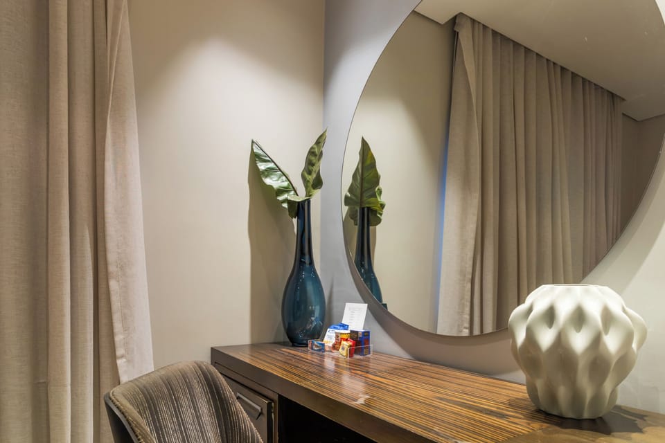 Presidential Studio Suite | Minibar, in-room safe, blackout drapes, iron/ironing board