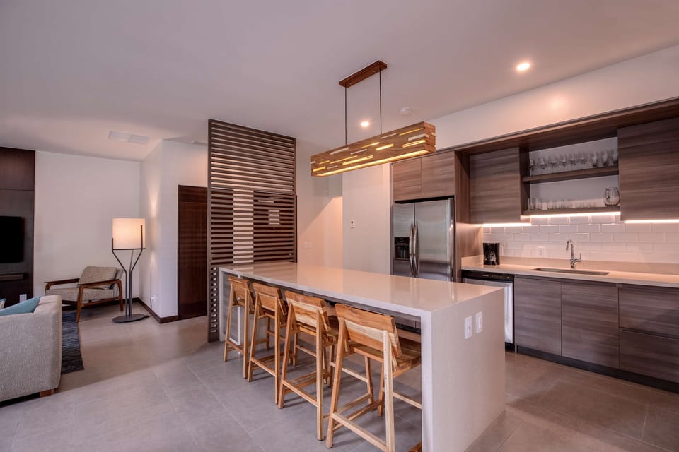Suite, Multiple Beds, Garden View | Private kitchen | Coffee/tea maker, fridge, microwave