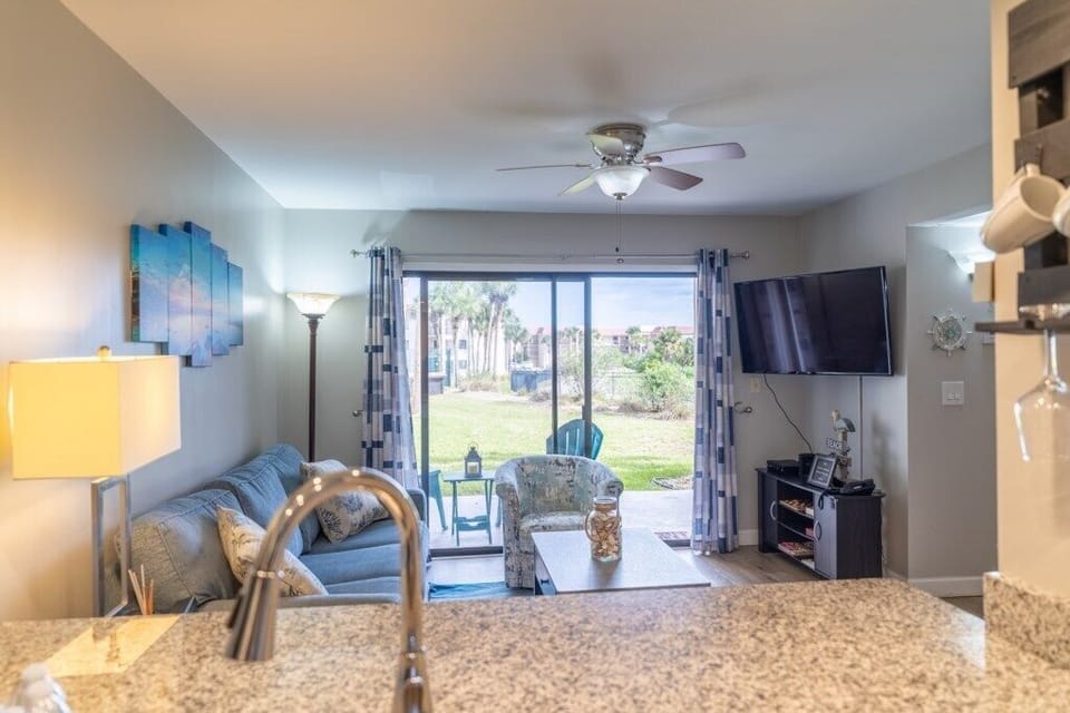 Condo, Multiple Beds, Pool View | Living area | 40-inch TV with digital channels