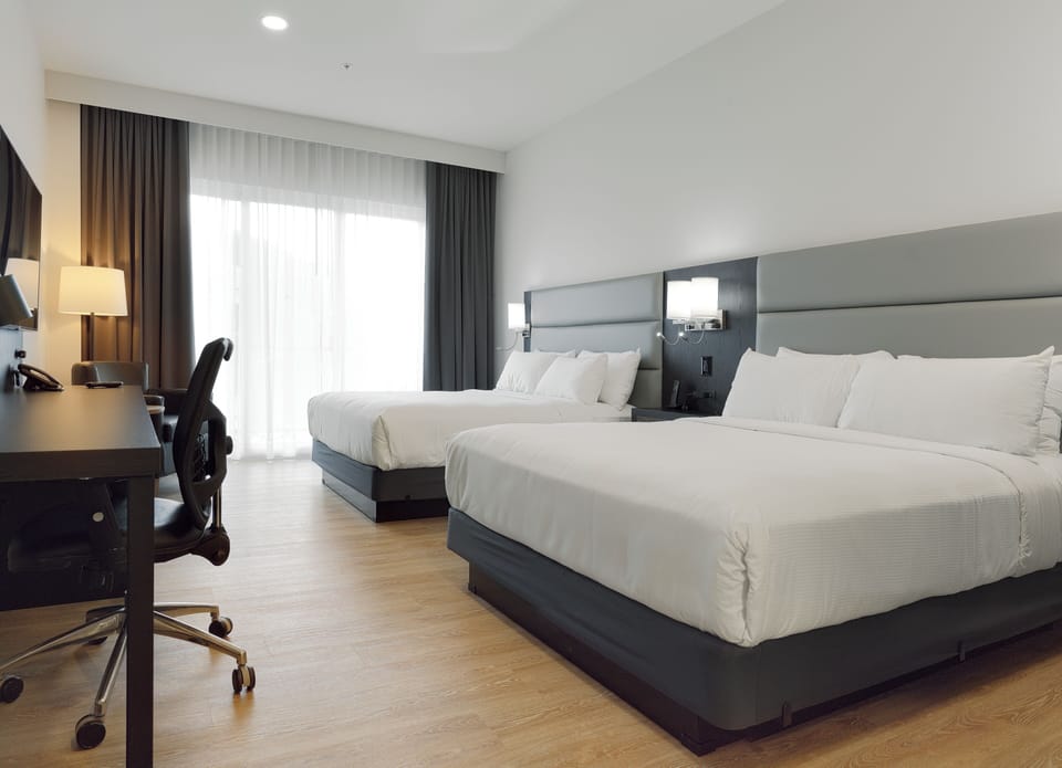 Room, 2 Queen Beds (Refuge Urbain) | Desk, blackout drapes, soundproofing, iron/ironing board