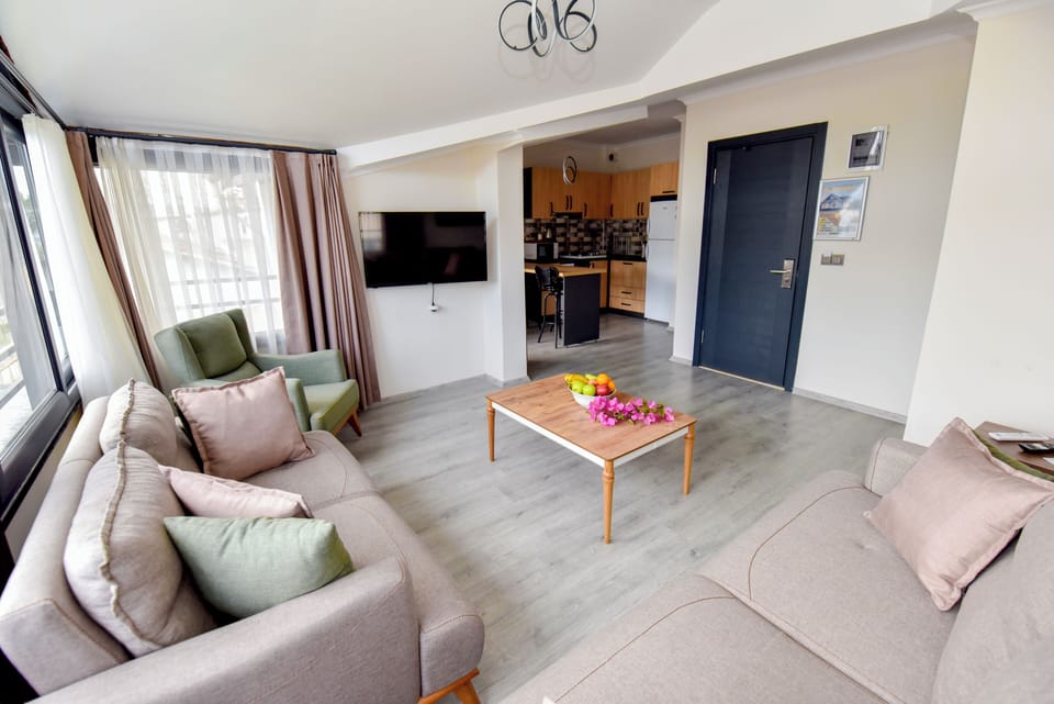 King Suite Sea View With Jacuzzi 1+1 888 | Living area | 43-inch Smart TV with satellite channels, TV, printers