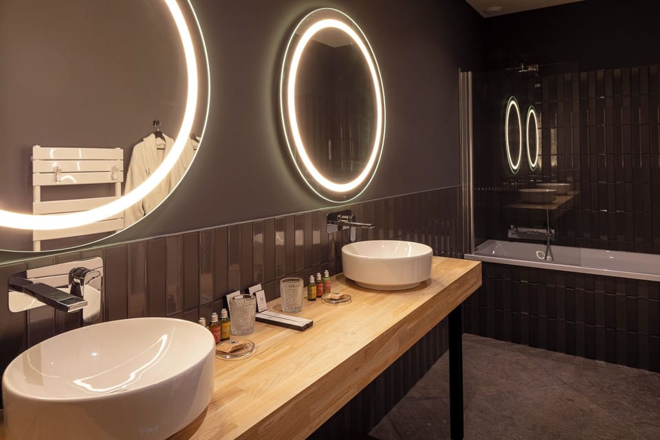 Presidential Suite | Bathroom | Designer toiletries, hair dryer, bathrobes, slippers