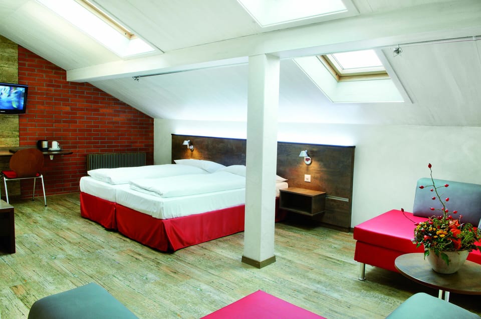 Standard Triple Room | Living area | Flat-screen TV