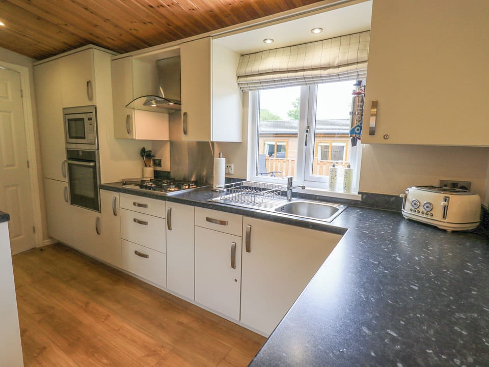 Fridge, electric kettle, toaster, cookware/dishes/utensils