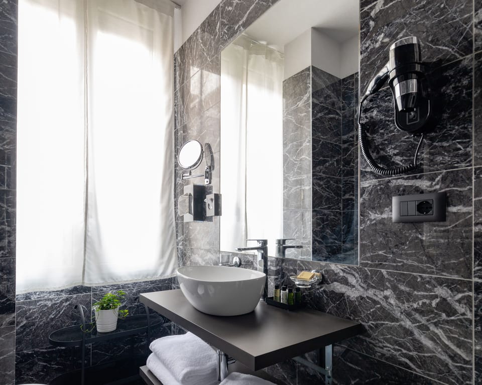 Shower, rainfall showerhead, designer toiletries, hair dryer