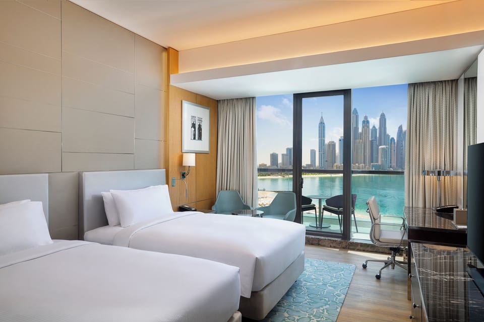 Premium Room, 2 Double Beds, Sea View | Minibar, in-room safe, desk, laptop workspace