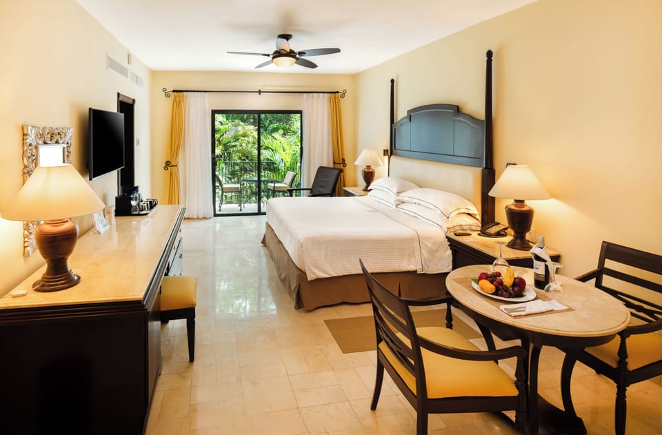 Royal Level Luxury | Minibar (free items), in-room safe, desk, blackout drapes