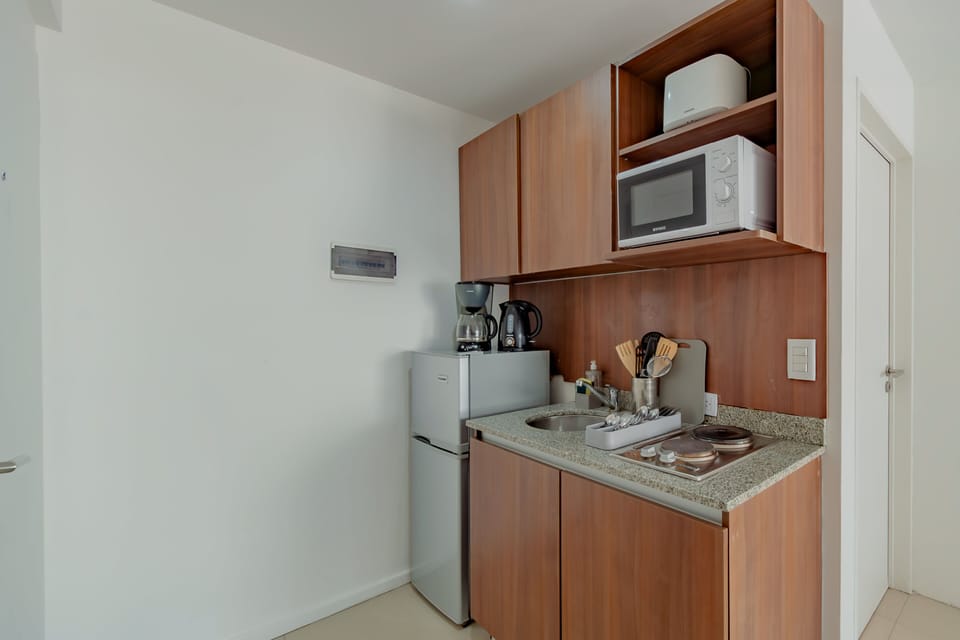 Apartment, 1 Bedroom, City View | Private kitchen | Full-size fridge, microwave, stovetop, coffee/tea maker