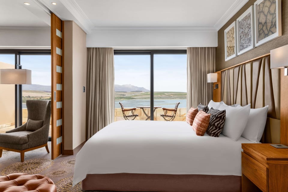 Premium Deluxe King Suite with Lagoon View | Premium bedding, in-room safe, desk, laptop workspace