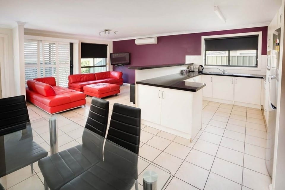 Apartment, 3 Bedrooms | Living area | Flat-screen TV, DVD player