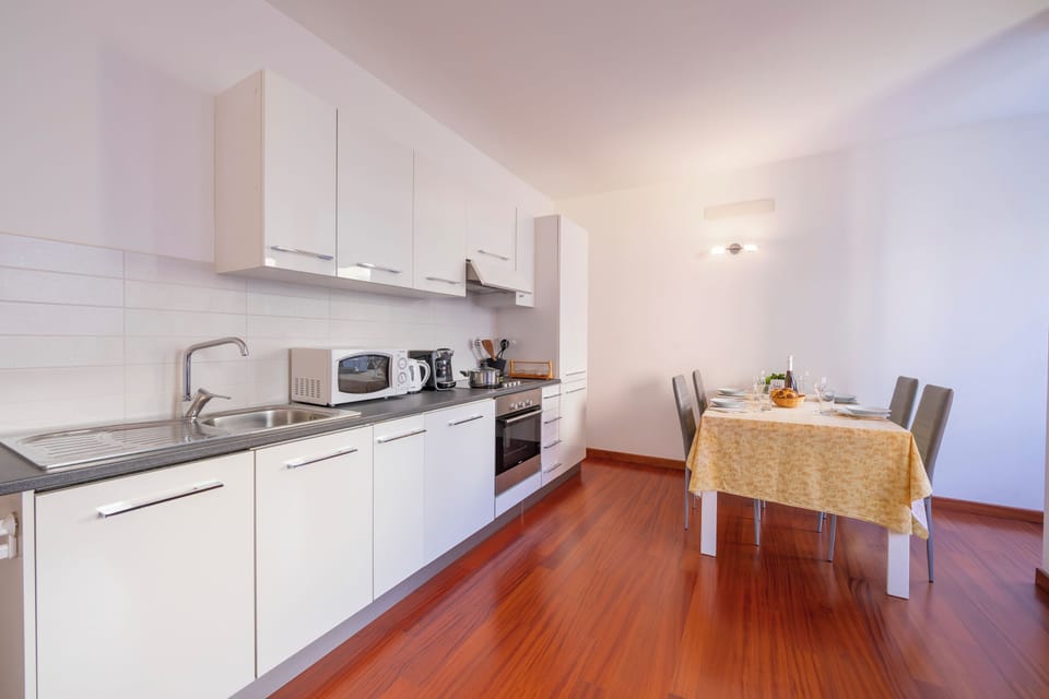Standard Apartment, 1 Bedroom, Balcony (Sunlight - 150m from the lake) | Private kitchen | Stovetop, electric kettle, dining tables