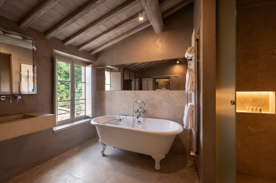 Deluxe Double Room, Valley View | Bathroom | Shower, rainfall showerhead, hair dryer, bathrobes