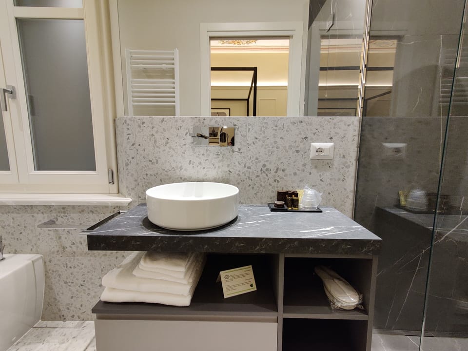 Luxury Room | Bathroom | Shower, rainfall showerhead, designer toiletries, hair dryer