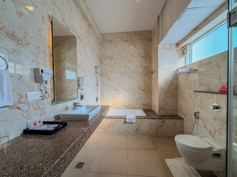 Suite | Bathroom | Shower, designer toiletries, hair dryer, slippers