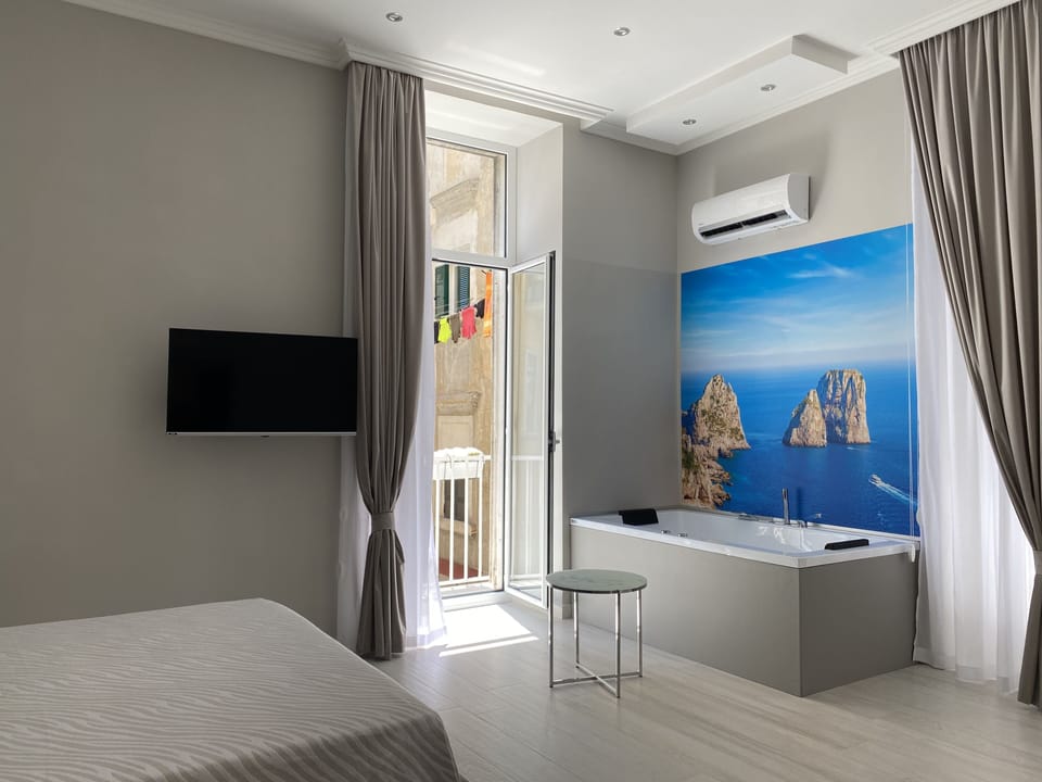 Luxury Room, Jetted Tub | Minibar, in-room safe, desk, blackout drapes