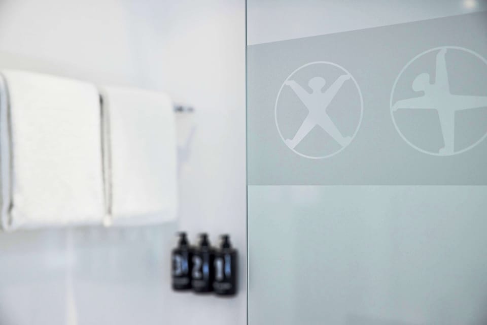 Eco-friendly toiletries, hair dryer, slippers, towels