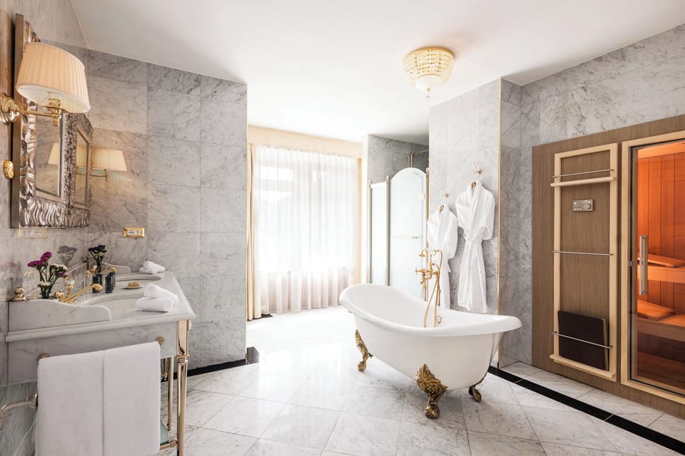 Presidential Suite | Bathroom | Designer toiletries, hair dryer, bathrobes, slippers