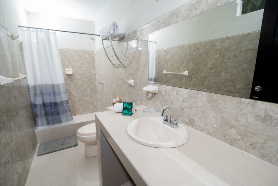 Shower, designer toiletries, towels, soap