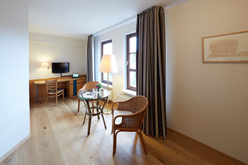 Comfort Double Room (Plus) | Living area | Flat-screen TV