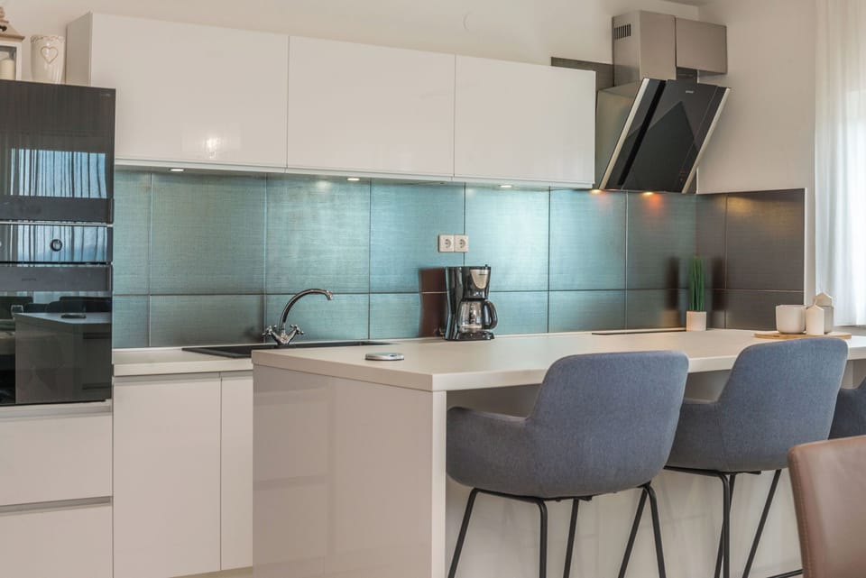 Espresso maker, fridge, oven, stovetop