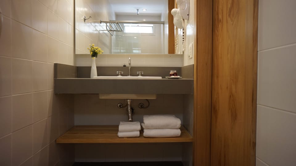 Shower, hair dryer, bathrobes, towels