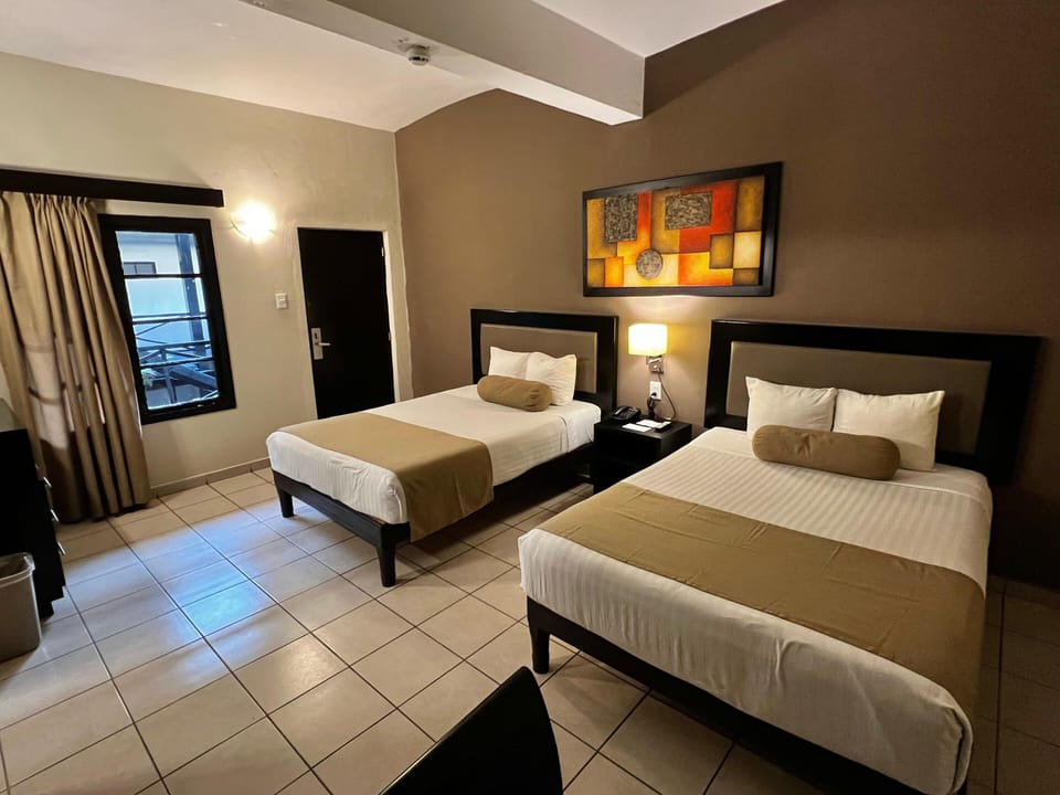 Standard Room, 2 Double Beds | Blackout drapes, iron/ironing board, free WiFi, bed sheets