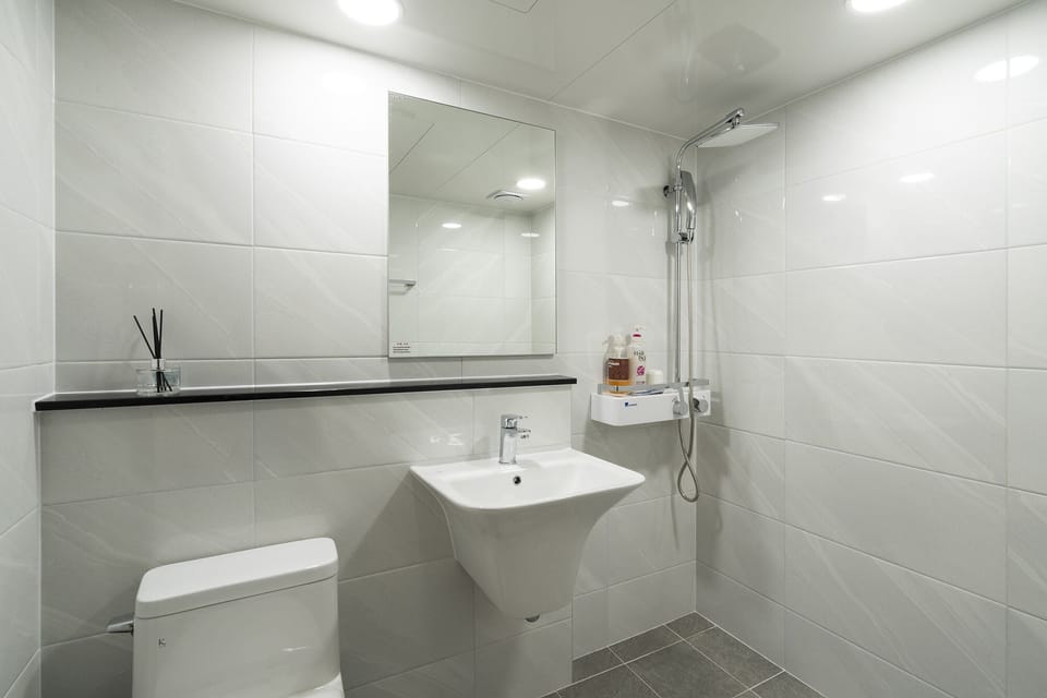 Shower, free toiletries, hair dryer, slippers
