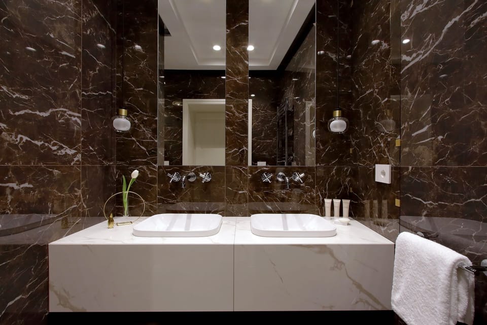 Shower, rainfall showerhead, designer toiletries, hair dryer