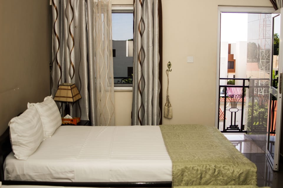 Twin Room | Minibar, in-room safe, desk, iron/ironing board (on request)