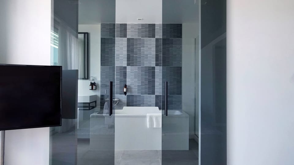 Suite, 1 King Bed, Pool Access | Bathroom | Eco-friendly toiletries, hair dryer, bathrobes, slippers