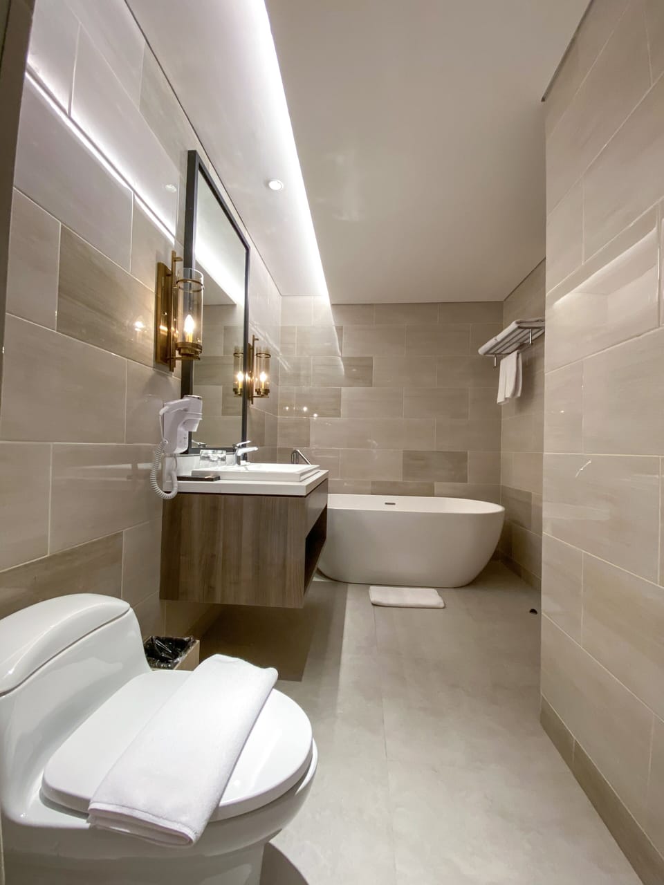 Suite, 1 King Bed | Bathroom | Shower, hair dryer, slippers, towels
