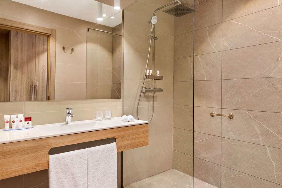 Eco-friendly toiletries, hair dryer, bathrobes, slippers