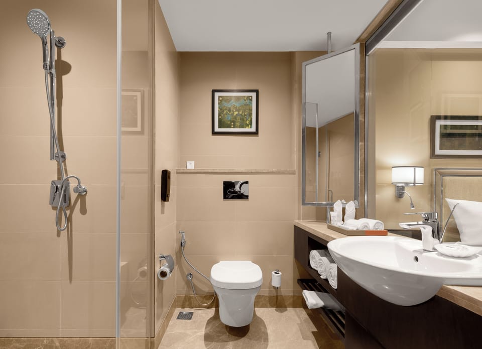 Designer toiletries, hair dryer, bathrobes, slippers