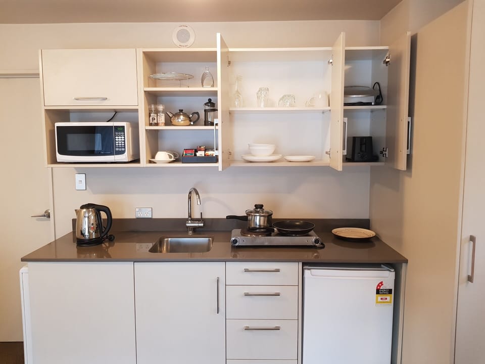 Espresso maker, coffee/tea maker, fridge, microwave