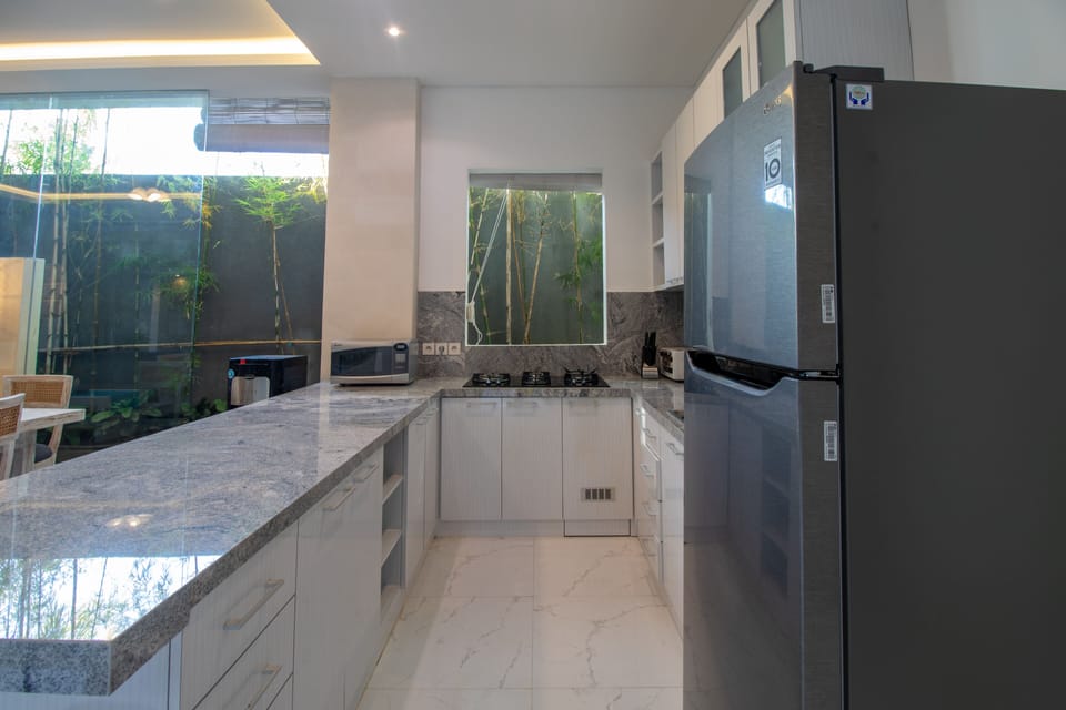Villa | Private kitchen | Electric kettle, dining tables