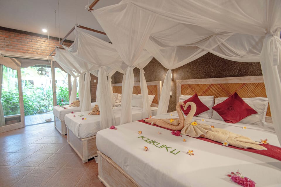 Family Quadruple Room, Garden View | Pillowtop beds, in-room safe, individually decorated