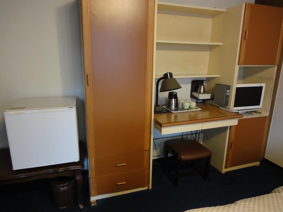 Desk, laptop workspace, bed sheets