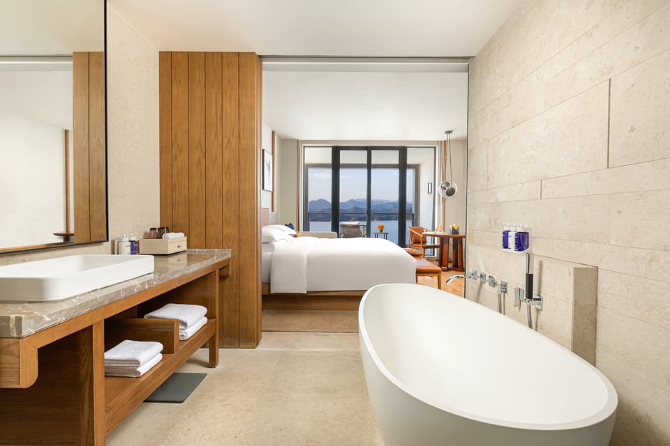 Premium bedding, down comforters, pillowtop beds, minibar