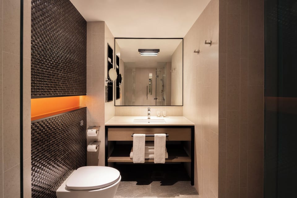 Executive Suite, 1 King Bed | Bathroom | Shower, free toiletries, hair dryer, bathrobes