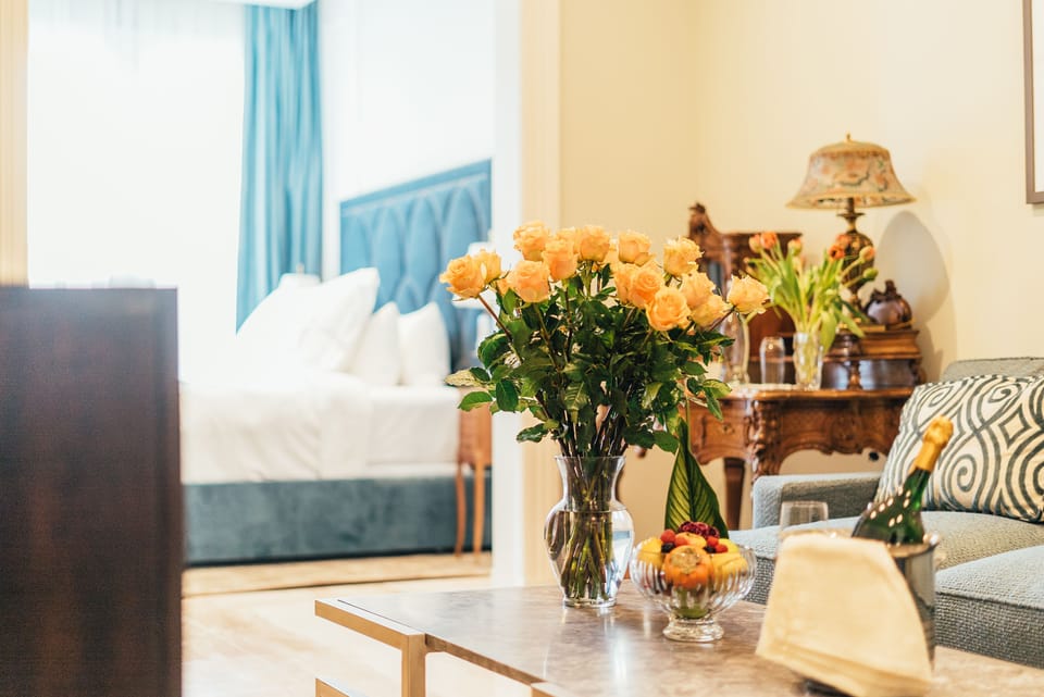 Superior King Suite | Living room | 47-inch flat-screen TV with cable channels, TV