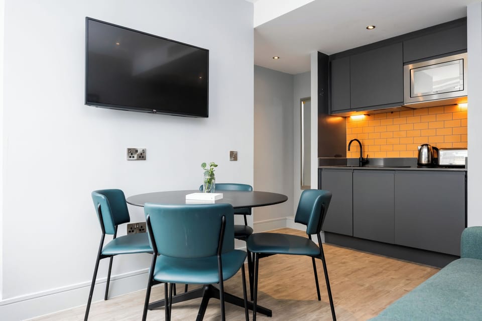 Apartment, 1 Bedroom | Living area | 32-inch flat-screen TV with digital channels, TV