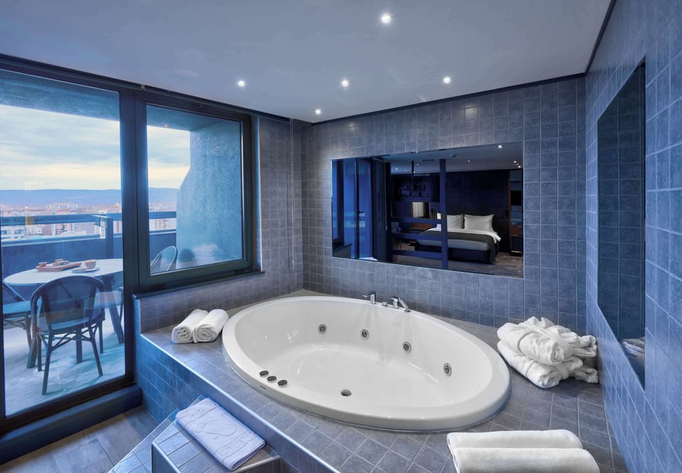 Shower, hair dryer, slippers, towels