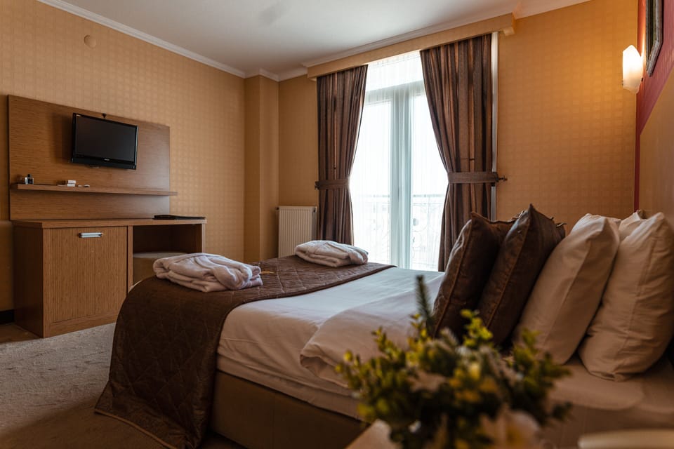 Premium bedding, desk, laptop workspace, soundproofing