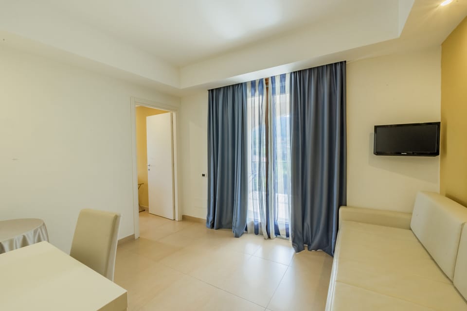Junior Suite, Balcony | Living area | LCD TV